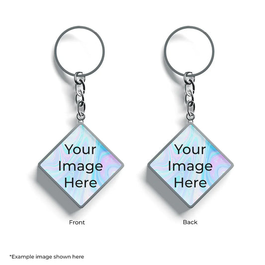 Customizable metal keychain with double-sided diamond-shaped photo area, chain and ring.