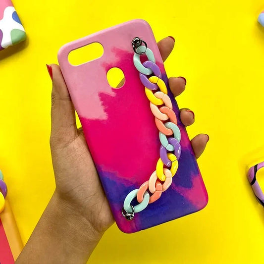 Hand holding pink and purple gradient phone case with pastel chunky chain charm