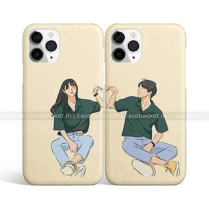 Matching couple phone cases with cartoon boy and girl illustration in casual outfits